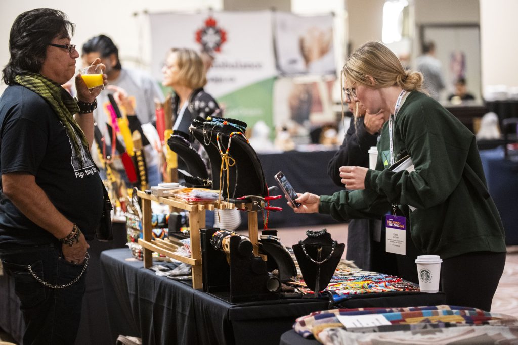 Woman browsing a booth with jewelery