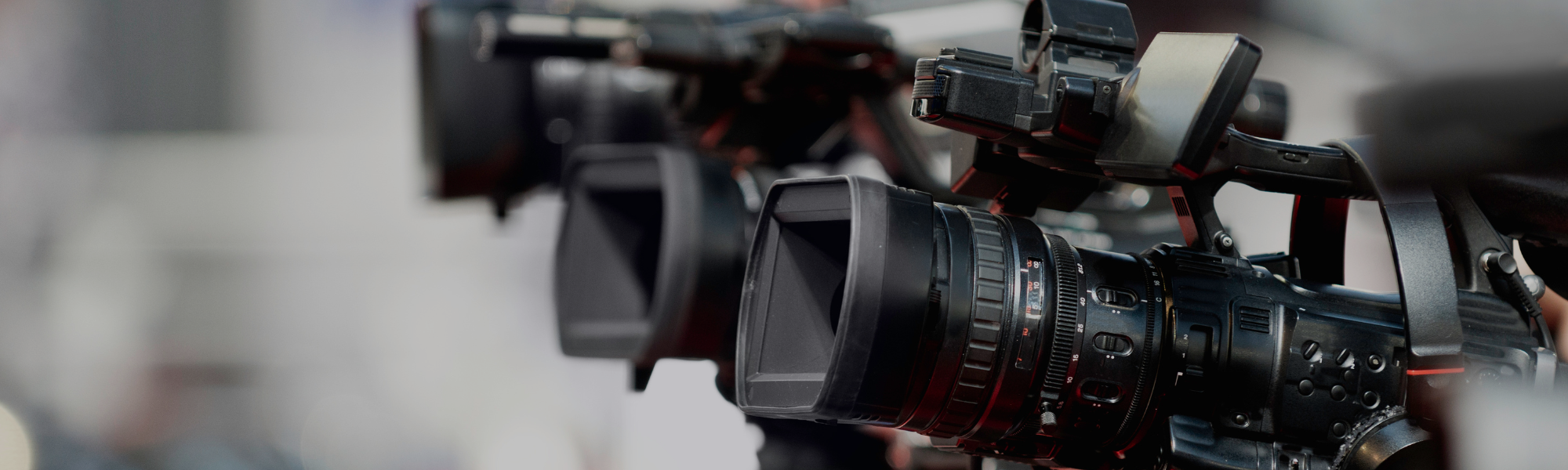 Photo of a camera at a press conference